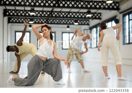 Asian woman studying movement of contemporary dance Asian woman studying movement of contemporary dance 122043356
