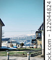 Snowy mountain and house in countryside with blue sky 122044824