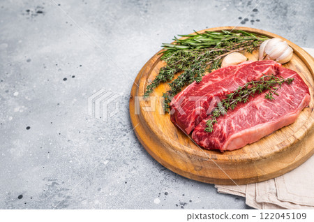 Raw beef marbled steak, Australian Oyster Top blade steak. grey background. top view 122045109