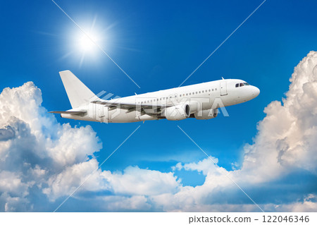 White passenger aircraft is climbing in the air above scenic clouds White passenger aircraft is climbing in the air above scenic clouds 122046346