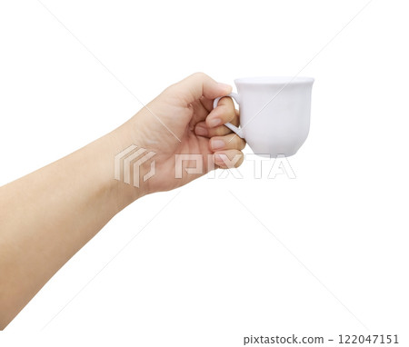 One hand holds a white ceramic coffee cup. 122047151