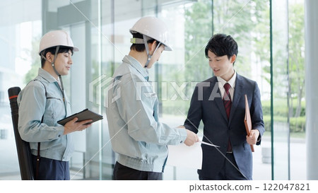 A man in work clothes having a meeting with a client A man in work clothes having a meeting with a client 122047821