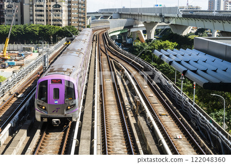 View of a Taoyuan International Airport line train running on the elevated track of the Taoyuan Mass Rapid Transit System. 122048360