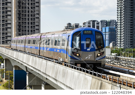 View of a Taoyuan International Airport line train running on the elevated track of the Taoyuan Mass Rapid Transit System. 122048394