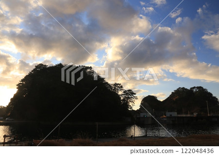 A beautiful sunset over the island at Nishina Port A beautiful sunset over the island at Nishina Port 122048436