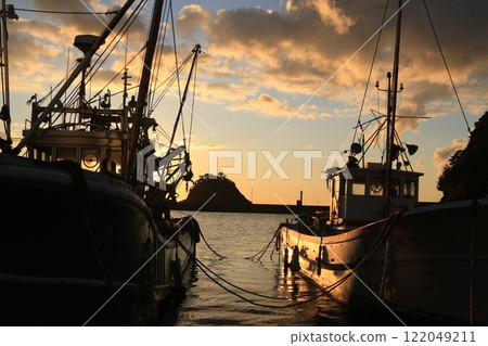 A beautiful sunset over the island at Nishina Port 122049211
