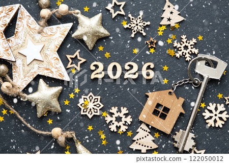 House key with keychain cottage on festive black background with stars, lights of garlands. New Year 2026 wooden letters, greeting card. Purchase, construction, relocation, mortgage, insurance House key with keychain cottage on festive black background with stars, lights of garlands. New Year 2026 wooden letters, greeting card. Purchase, construction, relocation, mortgage, insurance 122050012