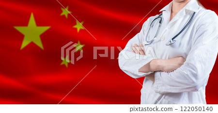 Doctor with crossed arms on China flag. China Health and Care concept. Female doctor on China flag 122050140