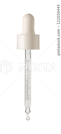 Drop of serum falls from glass pipette 122050445