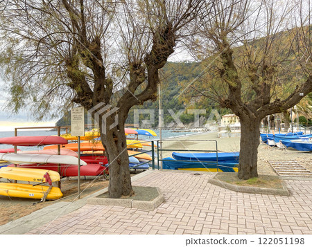 Beach and trees of Liguria near sea. Nature of Mediterranean Sea in winter. Background for design. Beach and trees of Liguria near sea. Nature of Mediterranean Sea in winter. Background for design. 122051198