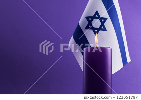 Holocaust memorial day. Candle and Flag 122051787