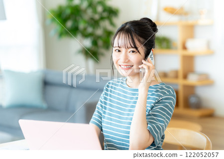 Women calling on a smartphone 122052057