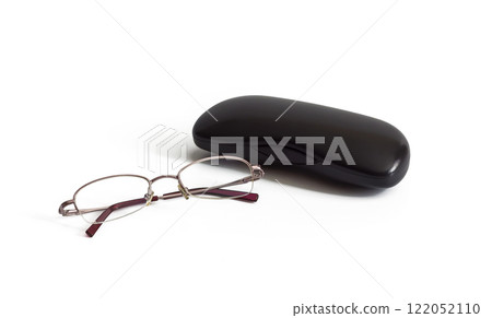Women's eyeglasses for vision and case lie on white background 122052110