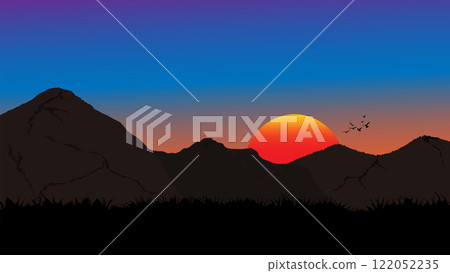 A striking silhouette of mountains against a vibrant sunset sky A striking silhouette of mountains against a vibrant sunset sky 122052235