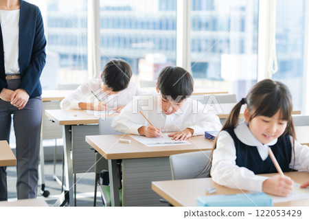Children taking a test Children taking a test 122053429