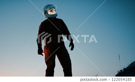 Silhouette Of An Astronaut Explores A New Abandoned Planet At Night 122054185
