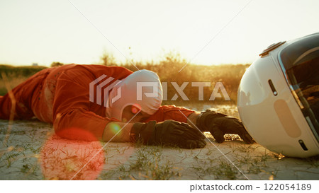 Astronaut Crawls On The Ground Suffocating On A Planet With Poisonous Air 122054189