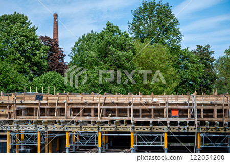 Wooden scaffolding on the construction site of a new bridge 122054200