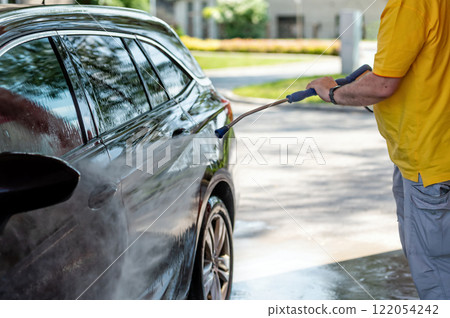 Manual wash for perfect clean car. Cleaning car using high pressure water. 122054242