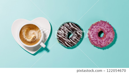 An assortment of vibrant donuts and a coffee cup on a heart-shaped saucer, perfect for a Valentines Day card An assortment of vibrant donuts and a coffee cup on a heart-shaped saucer, perfect for a Valentines Day card 122054670