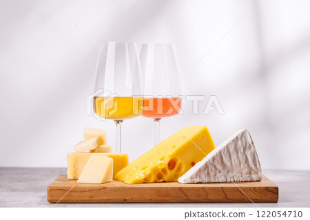 A delectable arrangement of various cheeses and wine A delectable arrangement of various cheeses and wine 122054710