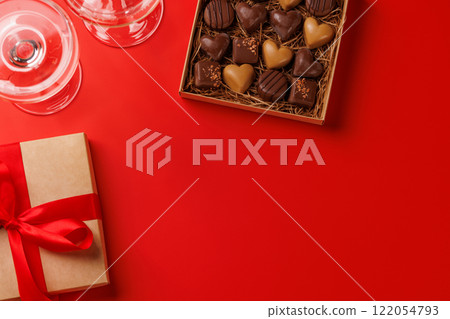 A glasses of champagne elegantly paired with a box of rich chocolates 122054793
