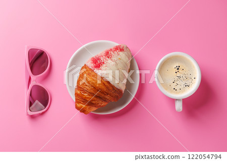 A delightful pairing of a freshly brewed coffee and a raspberry croissant A delightful pairing of a freshly brewed coffee and a raspberry croissant 122054794