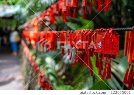 The vibrant and colorful Love Lock Bridge is beautifully surrounded by lush greenery and nature The vibrant and colorful Love Lock Bridge is beautifully surrounded by lush greenery and nature 122055001