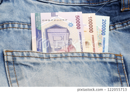 Uzbek sum in the pocket of blue jeans 122055713