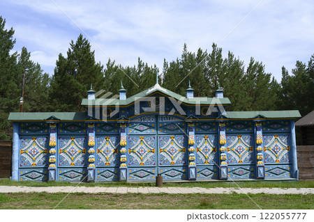 Blue painted and carved wooden gates decorated with semi-columns of early 20th century manor house Blue painted and carved wooden gates decorated with semi-columns of early 20th century manor house 122055777