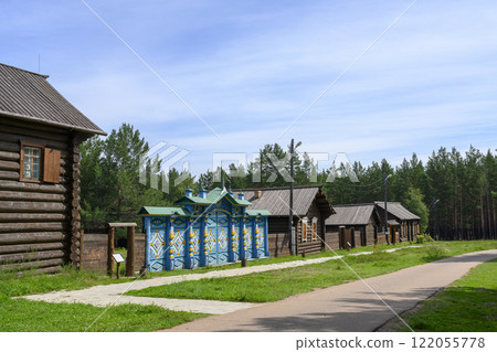 Street with restored manor houses of an early 20th century with blue painted and carved wooden gates Street with restored manor houses of an early 20th century with blue painted and carved wooden gates 122055778