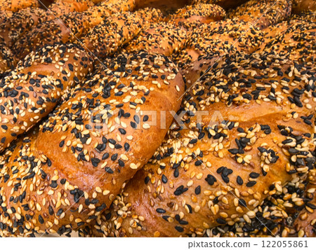 Freshly baked rolls topped with sesame seeds at a local bakery 122055861