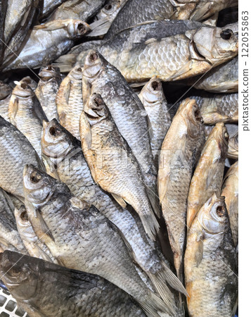 Dried fish in a busy market with a variety of fish varieties on offer 122055863