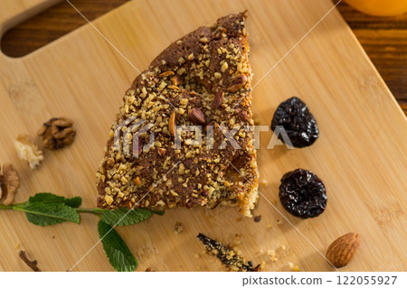 Homemade sponge cake with nuts and prunes 122055927