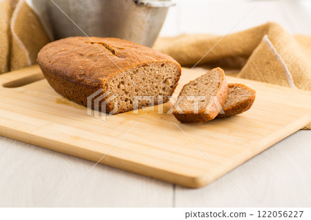 Sliced Homemade Bread on a Wooden Board 122056227