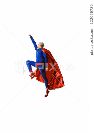 A man in blue superhero costume and red cape leaping upward with fist raised, showcasing energy, determination, and fantasy heroism 122056726