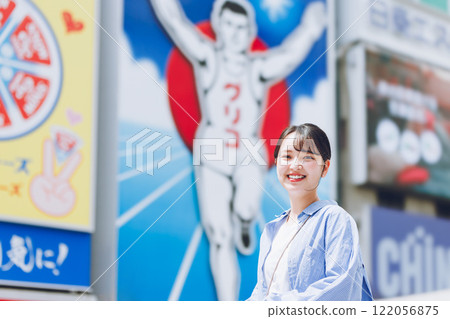 A young woman sightseeing in Osaka 122056875