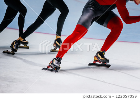 legs three man skaters at speed skating competition 122057059