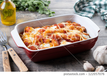 Gnocchi Alla Sorrentina on wooden table 122057076