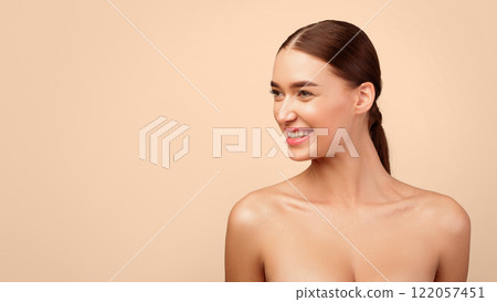 Happy Young Woman Looking Aside At Empty Space Posing Shirtless Over Gray Background. Portrait Of Lady For Advertisement Banner. Natural Female Beauty. Panorama, Studio Shot 122057451
