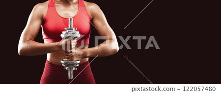 Cropped of muscular body of african fitness model with dumbbell over black background, strength, power concept 122057480