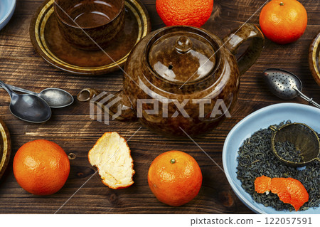 Hot tea with tangerines. Hot tea with tangerines. 122057591