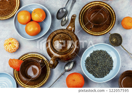 Tea pot with clementines. Tea pot with clementines. 122057595