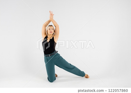 Dancer performing modern dance on white background Dancer performing modern dance on white background 122057860