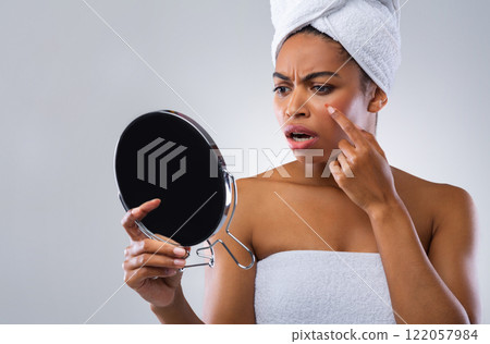 Angry afro girl looking at mirror, found pimple on her face, acne concept Angry afro girl looking at mirror, found pimple on her face, acne concept 122057984