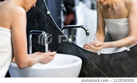 Hygiene Routine. Mature Lady Washing Face Standing Wrapped In Towel In Bathroom At Home. Selective Focus 122058308