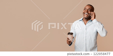 Great mobile connection. Cheerful mature african man with coffee talking on cellphone, orange studio background, free space Great mobile connection. Cheerful mature african man with coffee talking on cellphone, orange studio background, free space 122058477
