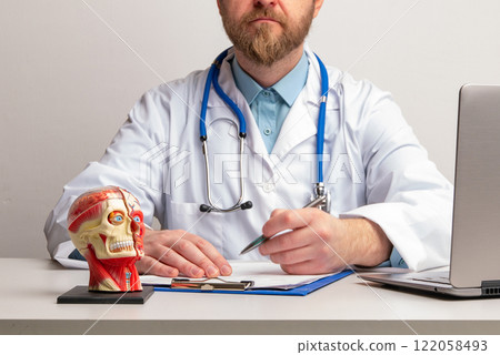 Doctor Hand with pen over cervical vertebrae of human head model. Neck pain, stiffness concept with red point. Arthritis, pinched nerve, strain. High quality photo Doctor Hand with pen over cervical vertebrae of human head model. Neck pain, stiffness concept with red point. Arthritis, pinched nerve, strain. High quality photo 122058493