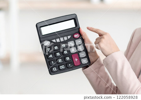 Tour Agent Woman Showing Calculator With Price To African American Family Couple Offering Tour Sitting In Office, Wearing Protective Face Masks. Great Travel Offer. Selective Focus Tour Agent Woman Showing Calculator With Price To African American Family Couple Offering Tour Sitting In Office, Wearing Protective Face Masks. Great Travel Offer. Selective Focus 122058928