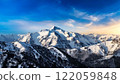 Snow-covered Alps and blue skies 122059848